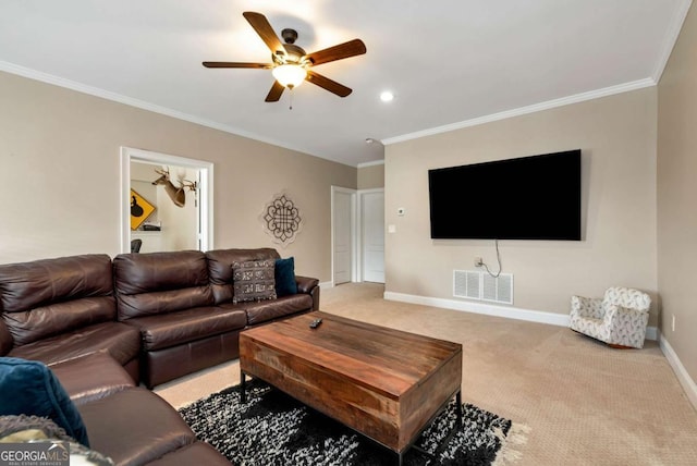 carpeted living room featuring ornamental molding and ceiling fan