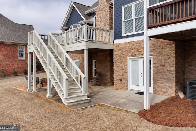 exterior space featuring central AC and a patio area