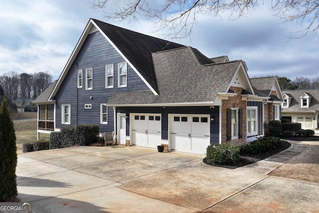 view of side of home with a garage