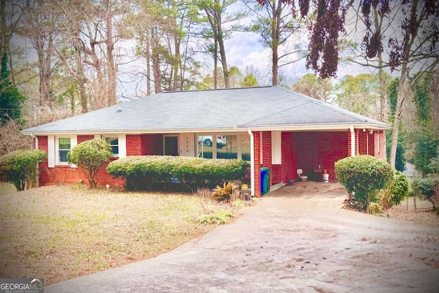 ranch-style house featuring a carport