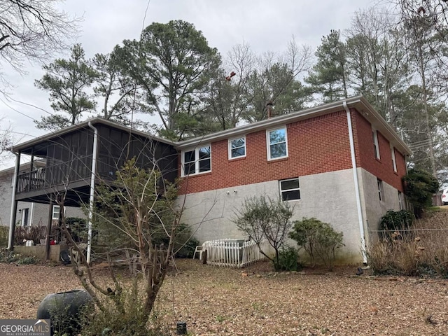 back of house with a sunroom