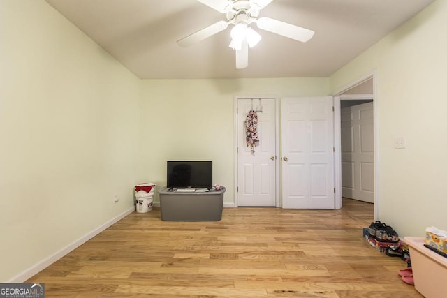 interior space with light hardwood / wood-style flooring and ceiling fan