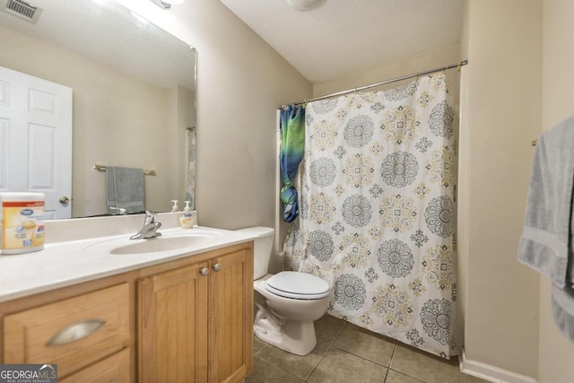 bathroom with walk in shower, vanity, toilet, and tile patterned flooring