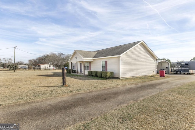 view of property exterior featuring a yard