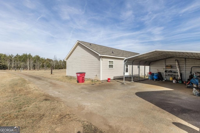 view of property exterior with a carport