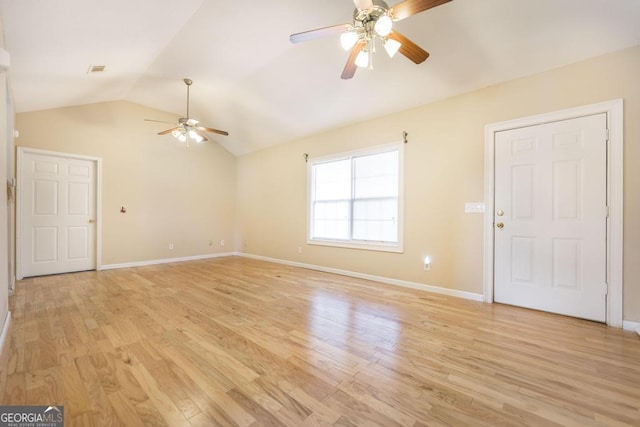 spare room with light hardwood / wood-style flooring, ceiling fan, and vaulted ceiling