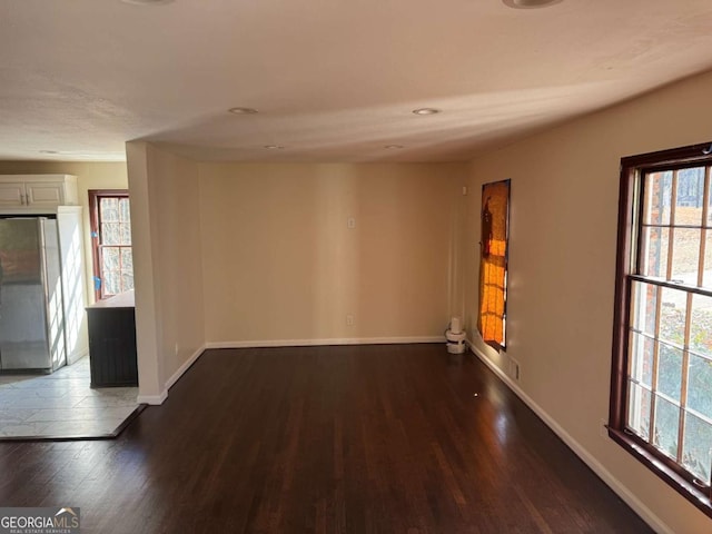 spare room featuring dark hardwood / wood-style floors