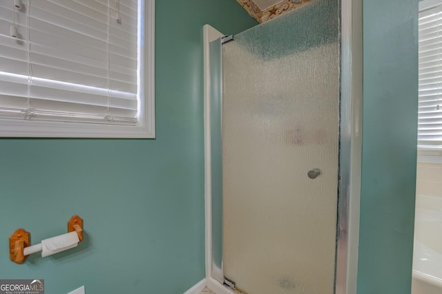 bathroom featuring an enclosed shower