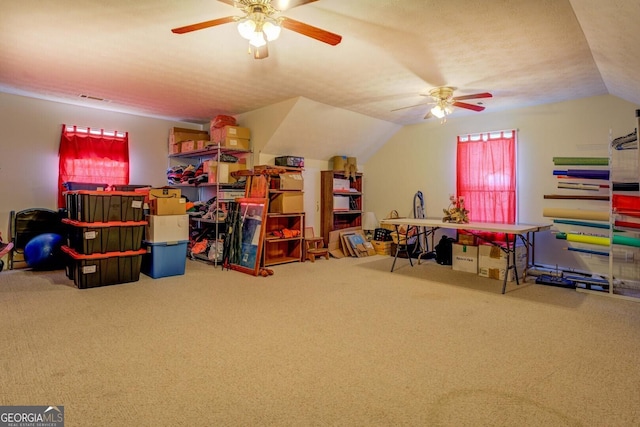 game room with vaulted ceiling, carpet, and ceiling fan