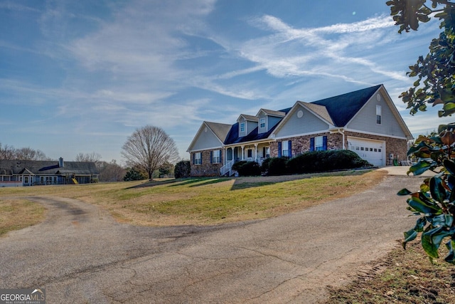 view of front facade featuring a garage and a front lawn