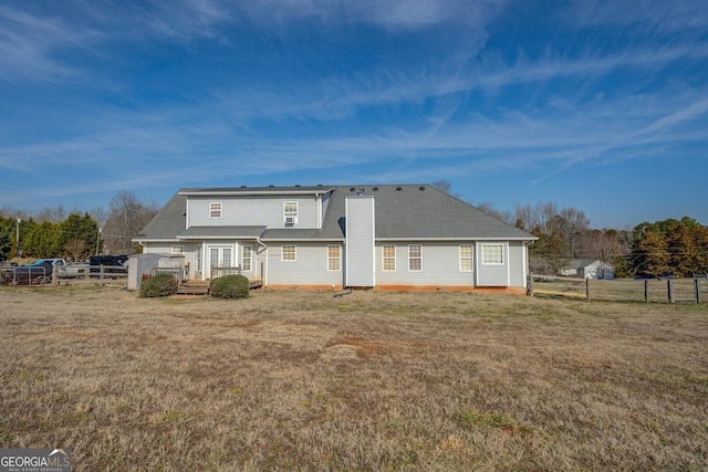 back of house with a yard