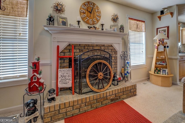 details with a fireplace and carpet flooring