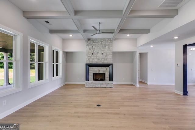 662 Lake Circle Rd, Buchanan, GA 30113 - unfurnished living room with a ceiling fan, light wood finished floors, baseboards, a fireplace, and beamed ceiling