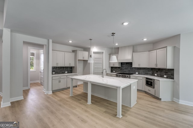 662 Lake Circle Rd, Buchanan, GA 30113 - kitchen featuring tasteful backsplash, light wood-style flooring, baseboards, pendant lighting, and recessed lighting