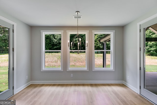 662 Lake Circle Rd, Buchanan, GA 30113 - unfurnished dining area with light wood-style floors, plenty of natural light, and baseboards