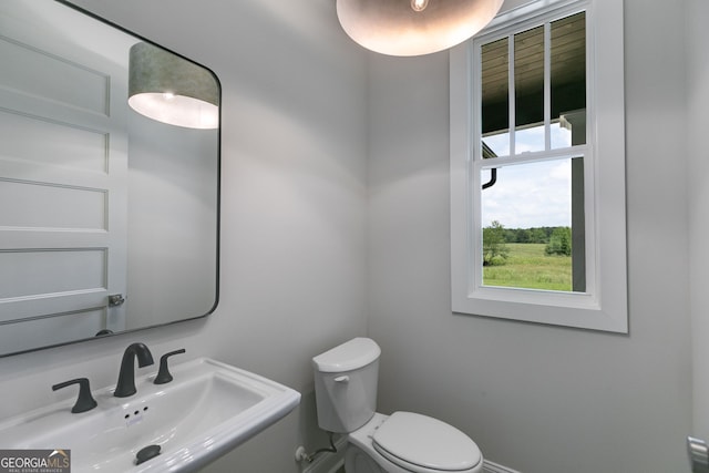 662 Lake Circle Rd, Buchanan, GA 30113 - half bathroom with a sink and toilet