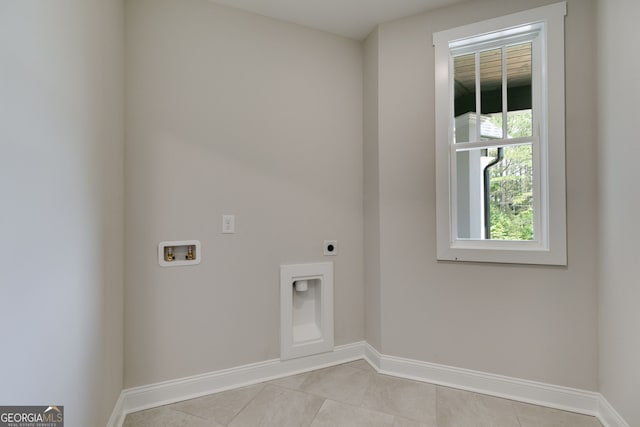 662 Lake Circle Rd, Buchanan, GA 30113 - laundry room with electric dryer hookup, washer hookup, baseboards, and light tile patterned floors