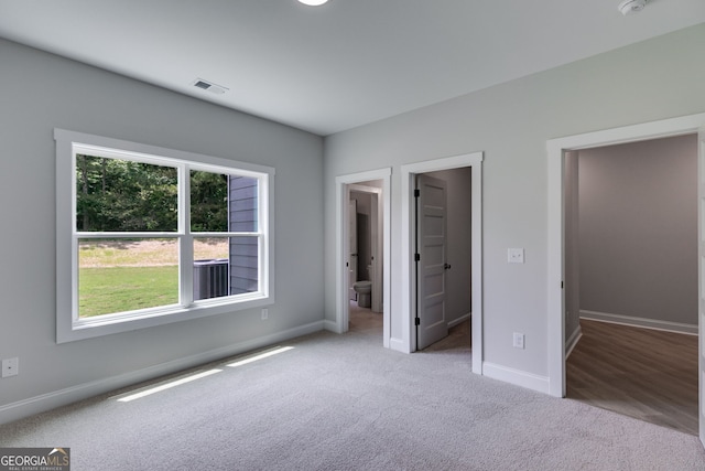 662 Lake Circle Rd, Buchanan, GA 30113 - unfurnished bedroom with carpet flooring, baseboards, and a spacious closet