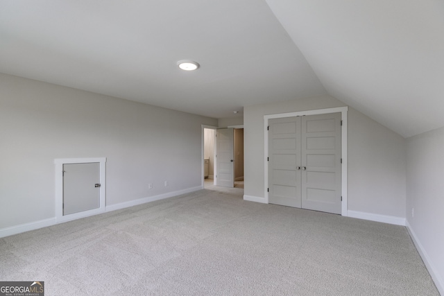 662 Lake Circle Rd, Buchanan, GA 30113 - additional living space featuring light colored carpet, vaulted ceiling, and baseboards