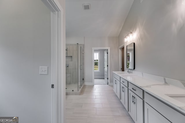 662 Lake Circle Rd, Buchanan, GA 30113 - bathroom featuring double vanity, a shower stall, tile patterned flooring, and baseboards
