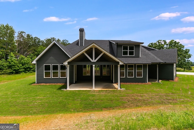 662 Lake Circle Rd, Buchanan, GA 30113 - back of house with a patio area, a shingled roof, a lawn, and a chimney