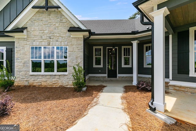 662 Lake Circle Rd, Buchanan, GA 30113 - property entrance featuring stone siding, board and batten siding, covered porch, and roof with shingles