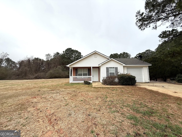 single story home with a garage, covered porch, and a front yard