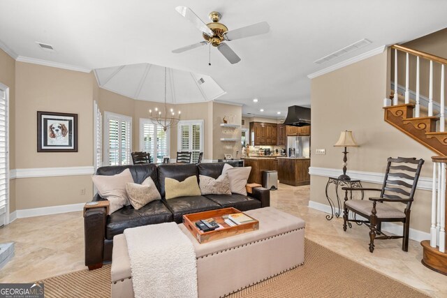 tiled living room featuring ornamental molding and ceiling fan with notable chandelier