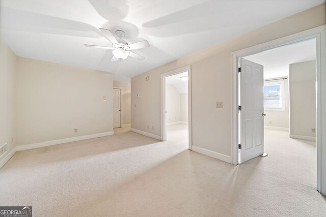 exercise room featuring lofted ceiling and light carpet