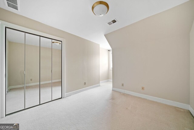 bedroom featuring lofted ceiling and carpet flooring