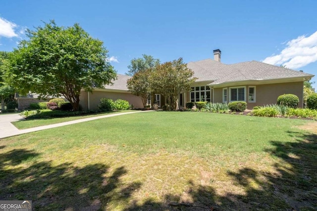 ranch-style home with a front yard