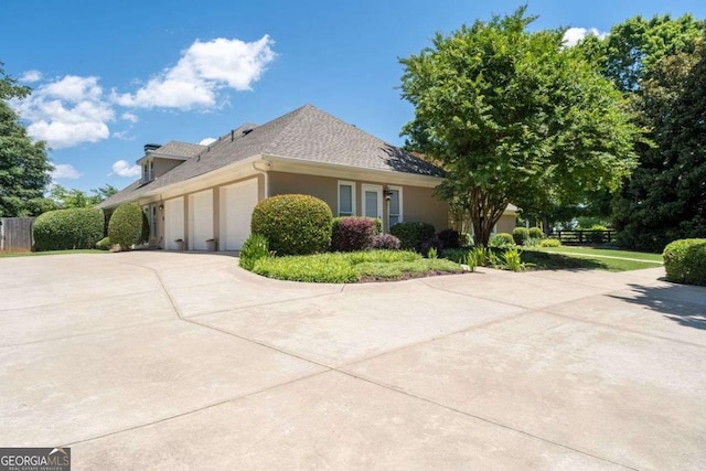 view of property exterior with a garage