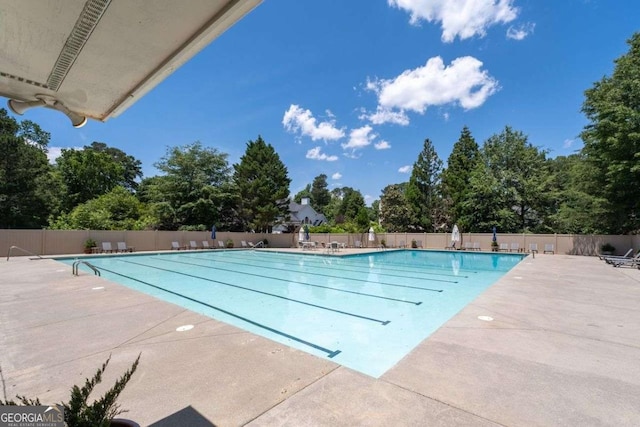 view of swimming pool featuring a patio area