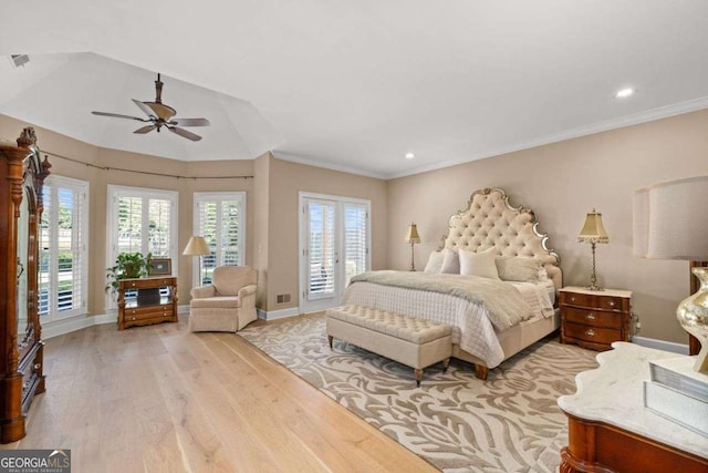 bedroom with crown molding, multiple windows, access to exterior, and light hardwood / wood-style flooring