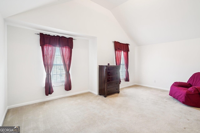 248 Allegrini Dr, Atlanta, GA 30349 - sitting room featuring light carpet, lofted ceiling, and baseboards