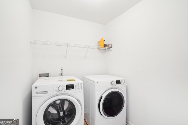 248 Allegrini Dr, Atlanta, GA 30349 - clothes washing area featuring laundry area and washing machine and clothes dryer