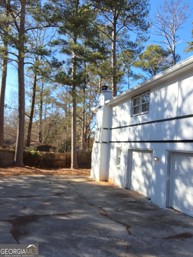 view of property exterior with a garage