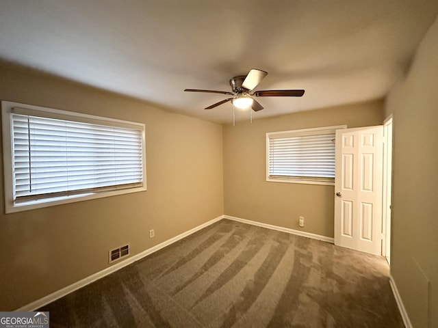 unfurnished bedroom with ceiling fan and carpet flooring