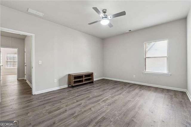 spare room featuring hardwood / wood-style flooring and ceiling fan