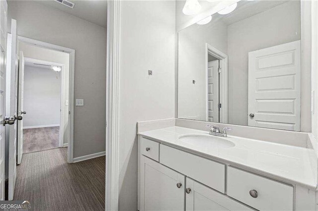 bathroom featuring vanity and hardwood / wood-style floors