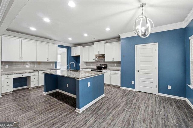 kitchen with sink, white cabinetry, light stone counters, stainless steel electric range, and a center island with sink