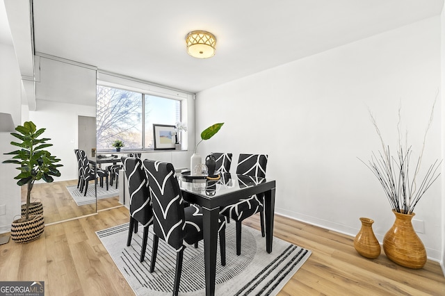 dining area with light wood-type flooring