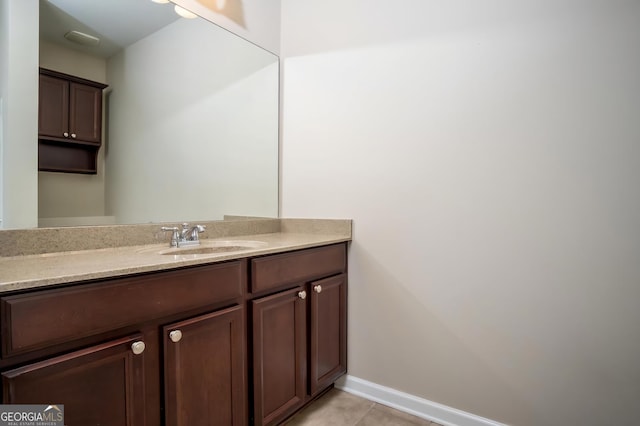 bathroom with tile patterned flooring and vanity