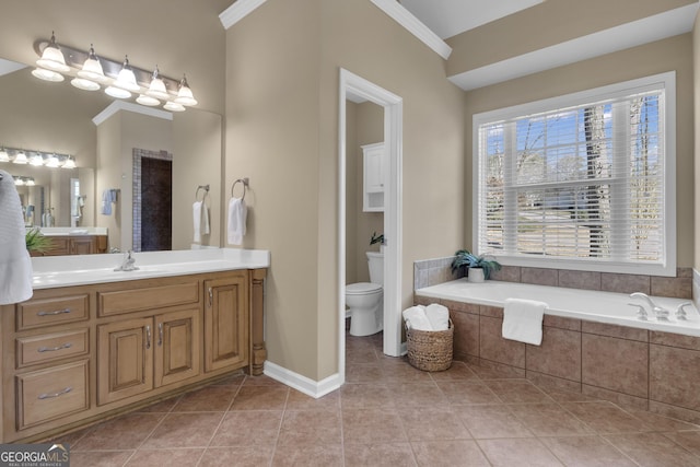full bathroom featuring baseboards, ornamental molding, toilet, tile patterned floors, and a garden tub