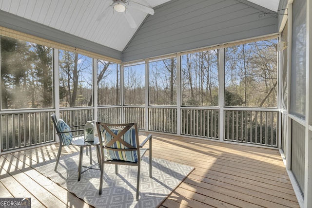 sunroom / solarium featuring a ceiling fan