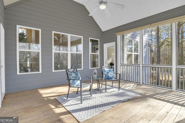sunroom featuring a ceiling fan