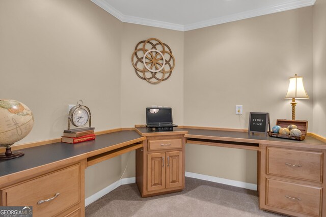 office area featuring crown molding, built in study area, light carpet, and baseboards