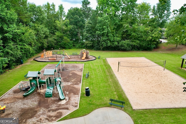 view of home's community with a lawn, volleyball court, and playground community