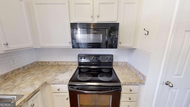 kitchen with tasteful backsplash, light stone counters, white cabinetry, and black appliances