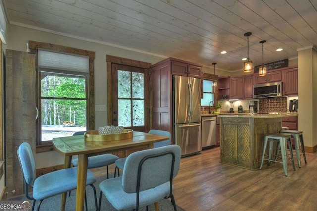 dining room with wood ceiling, sink, and hardwood / wood-style floors